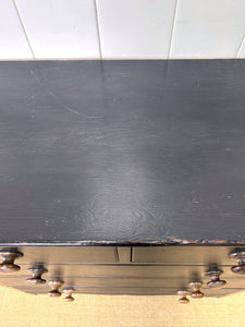An Ebonized Antique English Chest of Drawers/Dresser