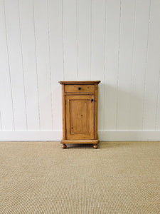 A Vintage Charming Pine Nightstand with Dark Knobs