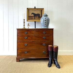 A Large Antique English Bow Front Mahogany Chest of Drawers