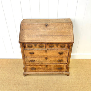 An Antique English Georgian Cumbrian Washed Oak Slant Front Desk