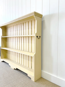 An Antique English Bookcase in Butter Yellow