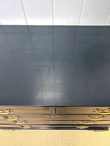 An Ebonized Antique English Chest of Drawers/Dresser