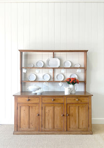 An Early 19th Century Monumental Pine Welsh Dresser or Cupboard