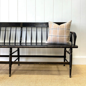 An Antique Ebonized Bench