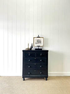 An Ebonized Antique English Chest of Drawers/Dresser