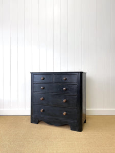 An Ebonized Antique English Chest of Drawers/Dresser