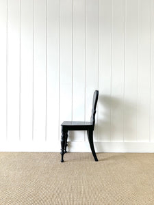 An Antique English Ebonized 19th Century Hall Chair
