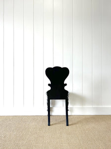 An Antique English Ebonized 19th Century Hall Chair