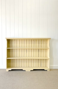 An Antique English Bookcase in Butter Yellow