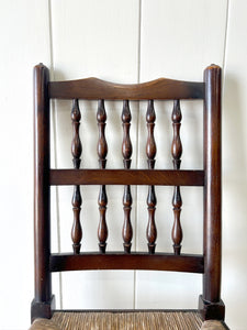 A Vintage Set of 6 English Oak Spindle Back Chairs with Rush Seats