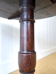 A George III Oak Circular Tilt-Top Tripod Tea Table