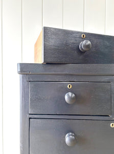 An Ebonized Antique English Chest of Drawers/Dresser