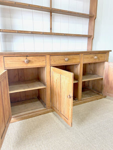 An Early 19th Century Monumental Pine Welsh Dresser or Cupboard