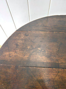 A George III Oak Circular Tilt-Top Tripod Tea Table