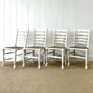 A Set of 4 Ladderback Rush Seat Chairs Painted White