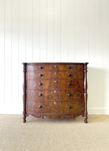 A Large Antique English Bow Front Mahogany Chest of Drawers