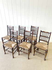 A Vintage Set of 6 English Oak Spindle Back Chairs with Rush Seats