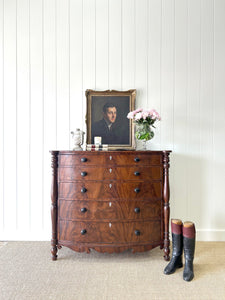A Large Antique English Bow Front Mahogany Chest of Drawers