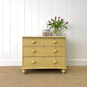 An Antique Painted Yellow English Chest of Drawers Dresser