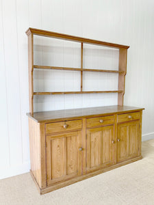 An Early 19th Century Monumental Pine Welsh Dresser or Cupboard