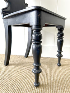 An Antique English Ebonized 19th Century Hall Chair