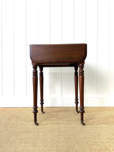 A Petite Early Victorian Mahogany Pembroke Table
