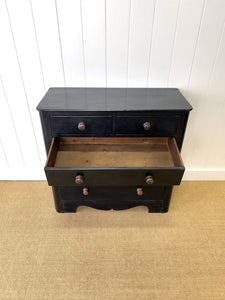 An Ebonized Antique English Chest of Drawers/Dresser