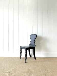 An Antique English Ebonized 19th Century Hall Chair