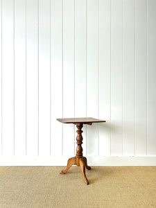 An Antique English Birch Tilt-top Table