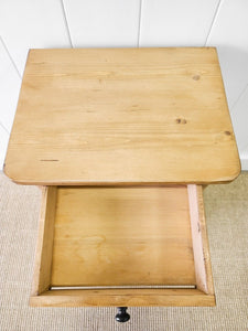 A Vintage Charming Pine Nightstand with Dark Knobs
