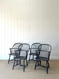 A Set of Four Black Windsor Armchairs