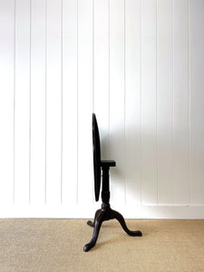 A George III Oak Circular Tilt-Top Tripod Tea Table