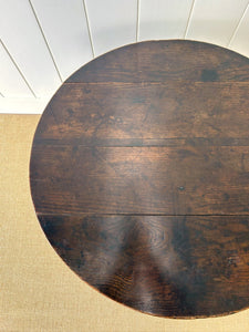 A George III Oak Circular Tilt-Top Tripod Tea Table