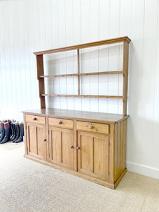 An Early 19th Century Monumental Pine Welsh Dresser or Cupboard