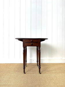 A Petite Early Victorian Mahogany Pembroke Table