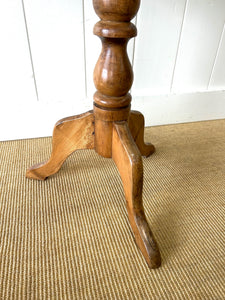 An Antique English Birch Tilt-top Table