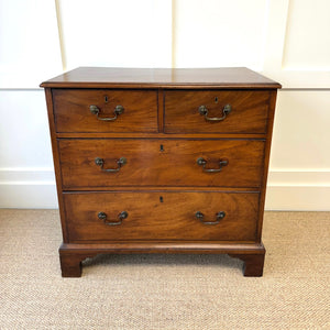 A English Georgian Chest of Drawers with Swan Neck Hardware