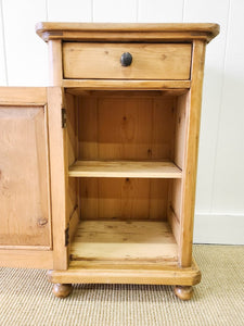A Vintage Charming Pine Nightstand with Dark Knobs
