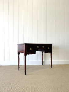 An Antique English Desk or Table with Three Drawers