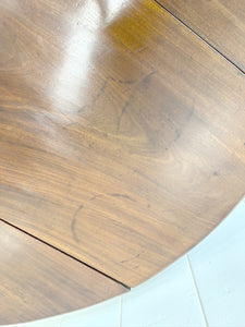 An Antique Mahogany Drop Leaf Dining Table with Pad Feet