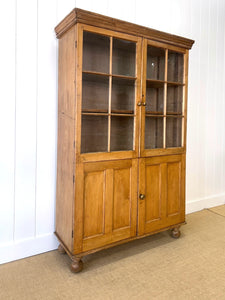 An English 19th Century Pine Bookcase with Glazed Doors