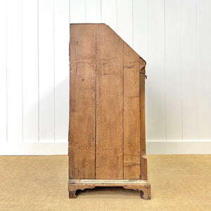 An Antique English Georgian Cumbrian Washed Oak Slant Front Desk