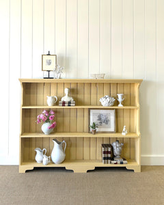 An Antique English Bookcase in Butter Yellow