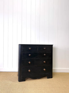 An Ebonized Antique English Chest of Drawers/Dresser