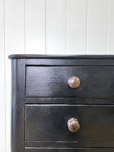 An Ebonized Antique English Chest of Drawers/Dresser