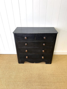 An Ebonized Antique English Chest of Drawers/Dresser