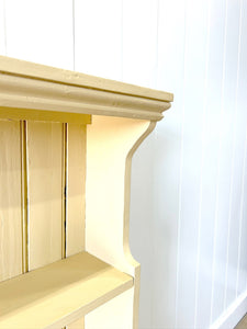 An Antique English Bookcase in Butter Yellow