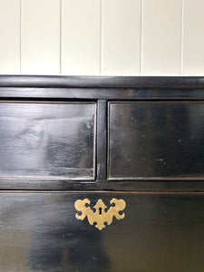 An Ebonized Antique English Chest of Drawers/Dresser
