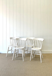 A Vintage Set of 4 White Slat Back Chairs