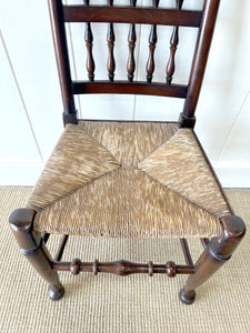 A Vintage Set of 6 English Oak Spindle Back Chairs with Rush Seats